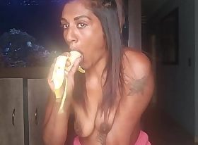 Topless desi squeezes her boobs as she sucks and deepthroats on a banana